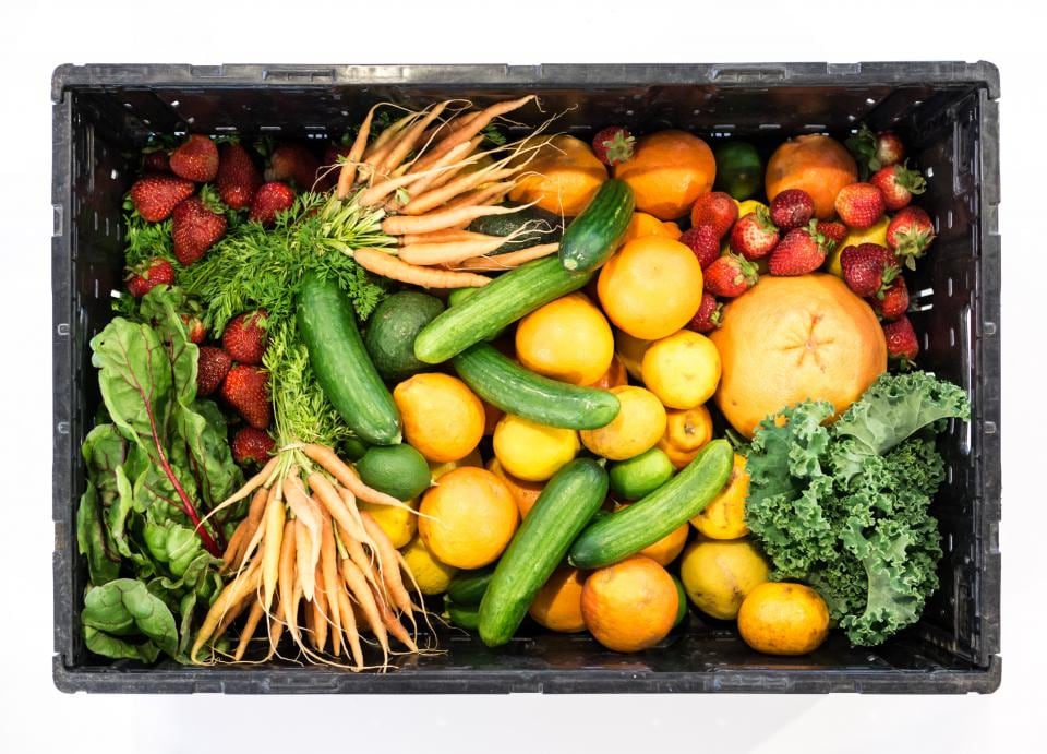 Crate of fresh vegetables and fruit